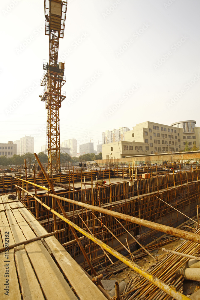 worker in the construction site making reinforcement metal frame