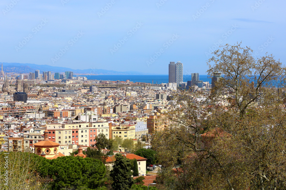 Panoramic view from National Art Museum of Catalonia on Barcelona with skyscrapers and the sea