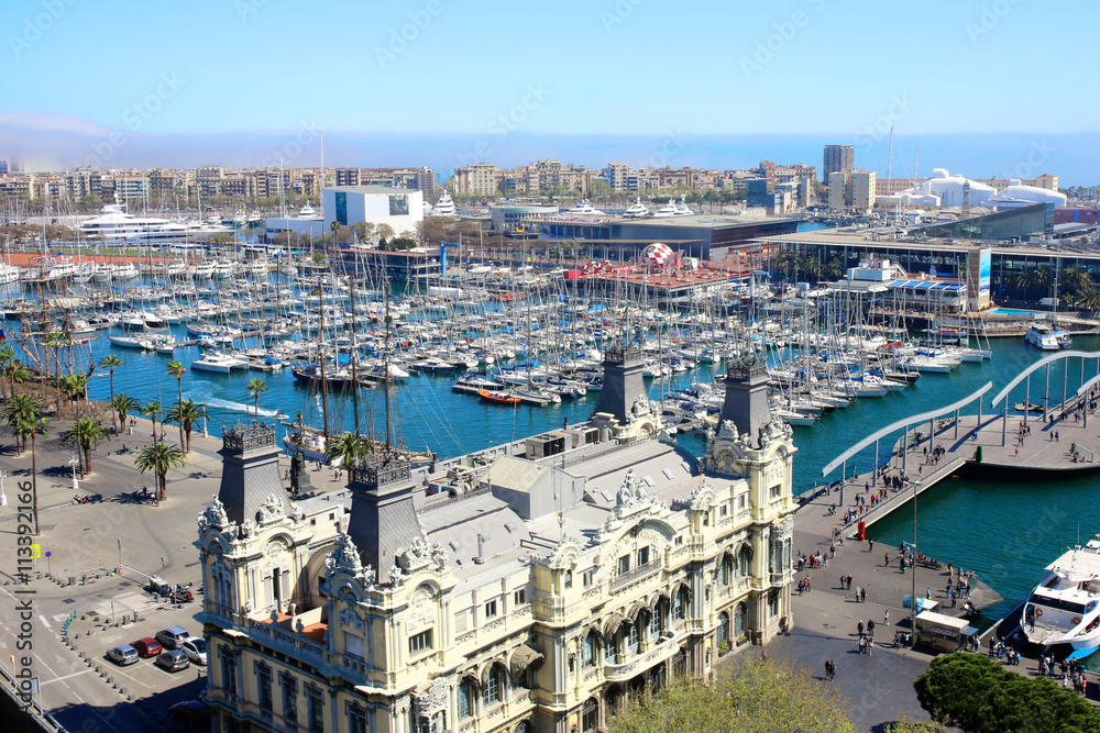 Port Vell and Maremagnum, in Barcelona, Spain. Aerial view from observation platform of Columbus monument.