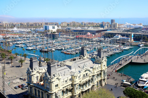 Port Vell and Maremagnum, in Barcelona, Spain. Aerial view from observation platform of Columbus monument.