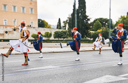 Changing of the honor Evzones guards ceremony in front of  the Tomb of the Unknown Soldier at the Parliament Building in Syntagma Square, Athens, Greece.