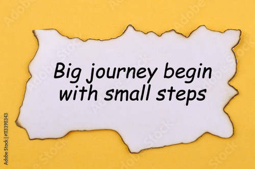 Text Big Journey Begin With Small Steps on Burnt Paper