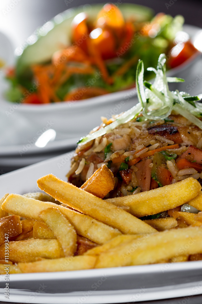 chicken fried rice with fries and a salad chicken fried rice with fries and a salad