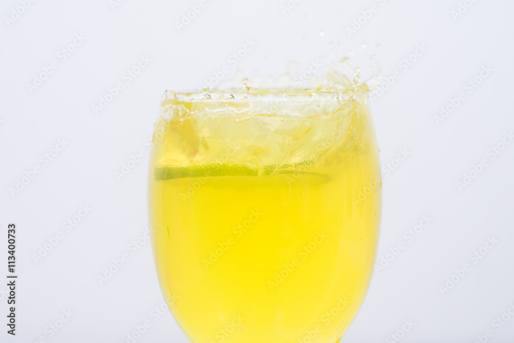 Lemonade in a glass.Isolated on white. Lemonade in a glass.Isolated on white.
