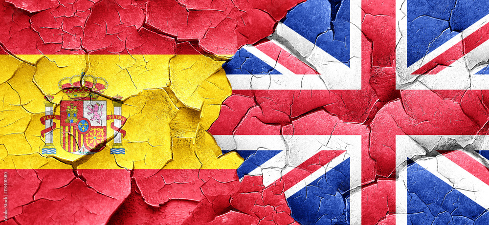 Spanish flag with Great Britain flag on a grunge cracked wall