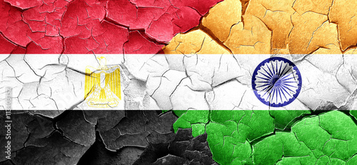 Egypt flag with India flag on a grunge cracked wall