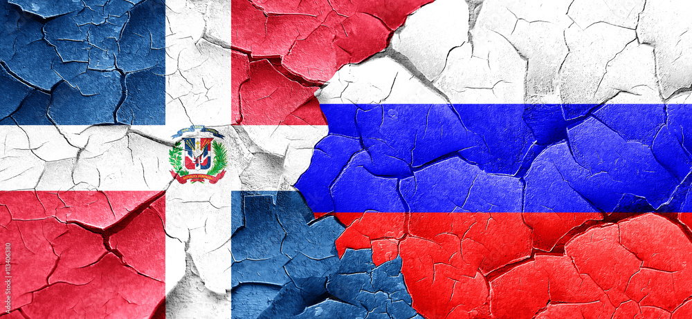 dominican republic flag with Russia flag on a grunge cracked wal