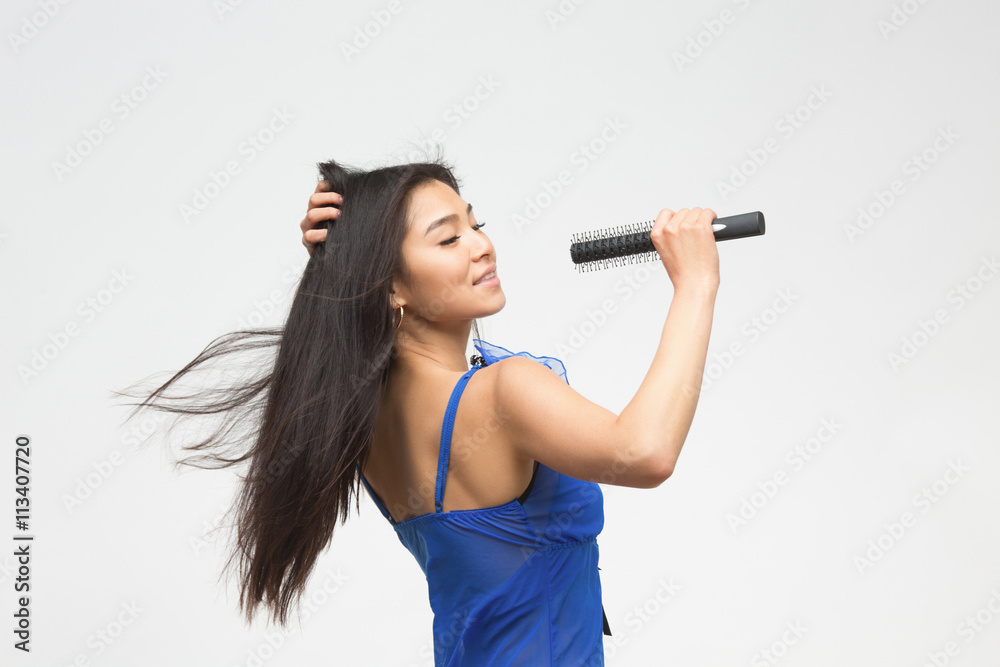 Portrait of singing fashion asian model in blue lingerie or underwear in  studio. Beautiful woman with black hair holding microphone in front of her.  Stock Photo | Adobe Stock