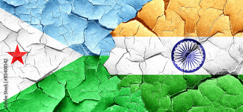 Djibouti flag with India flag on a grunge cracked wall