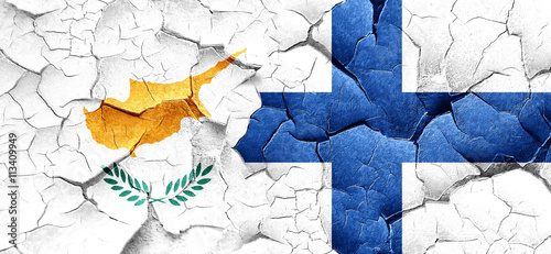 Cyprus flag with Finland flag on a grunge cracked wall