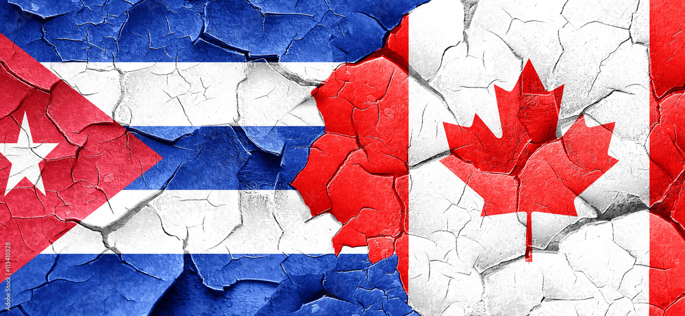 Cuba flag with Canada flag on a grunge cracked wall