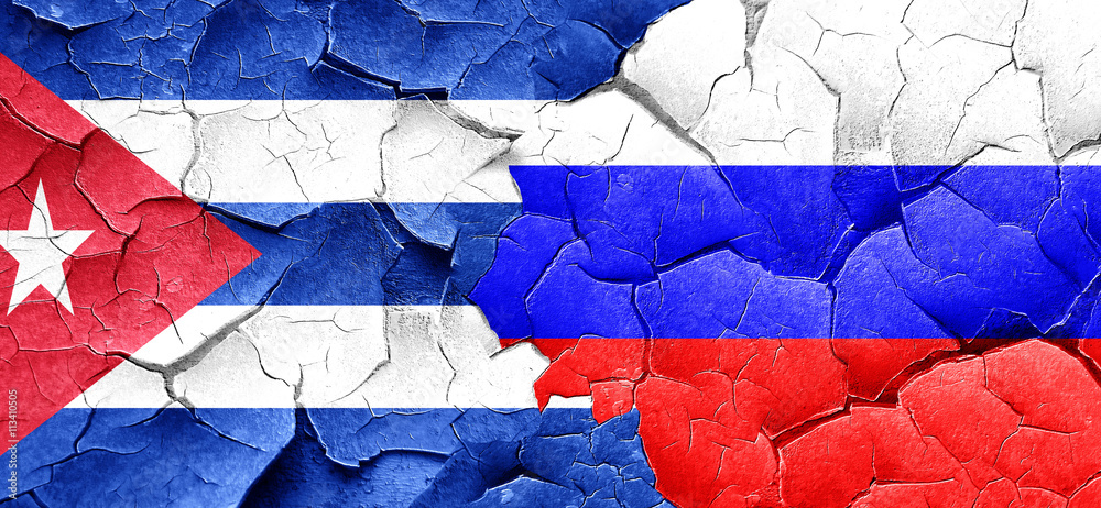 Cuba flag with Russia flag on a grunge cracked wall