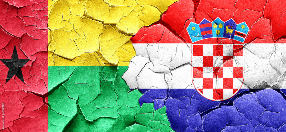 Guinea bissau flag with Croatia flag on a grunge cracked wall Guinea bissau flag with Croatia flag on a grunge cracked wall