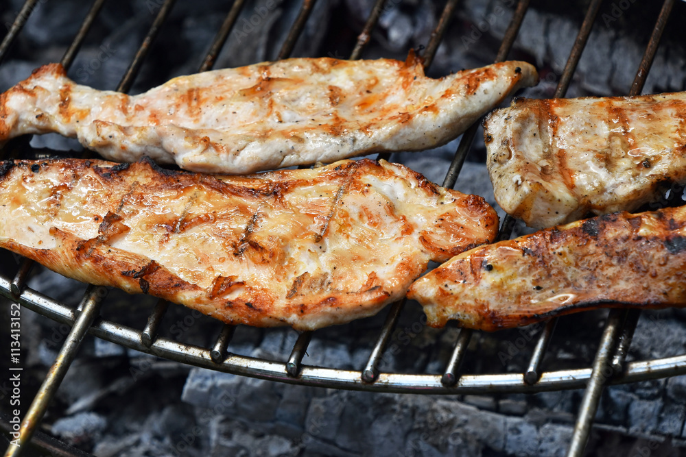 Chicken or turkey steak ready cooked on grill