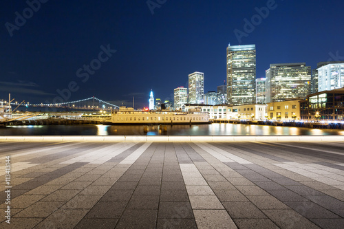 empty floor with modern buildings near water in san francisco