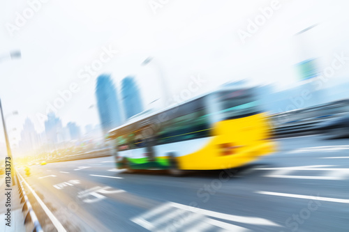 motion traffic on highway wity city background，chongqing china. photo