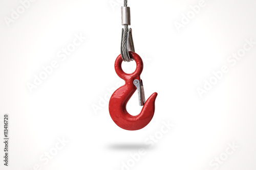 Red lifting crane hook isolated on white background photo