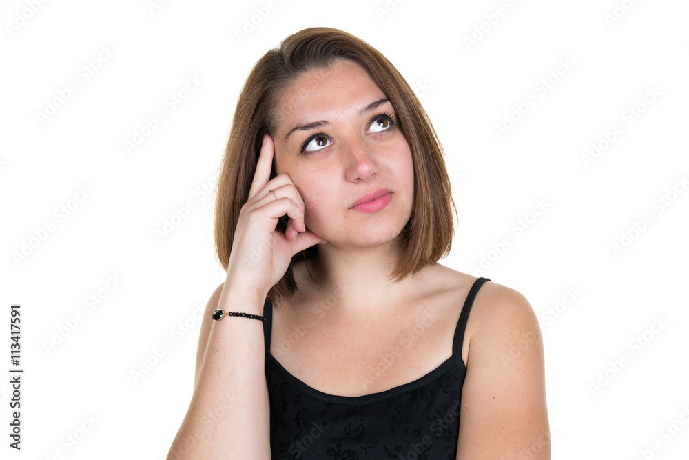 Portrait of a beautiful young woman thinking, looks up Portrait of a beautiful young woman thinking, looks up