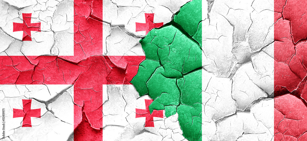 Georgia flag with Italy flag on a grunge cracked wall Georgia flag with Italy flag on a grunge cracked wall