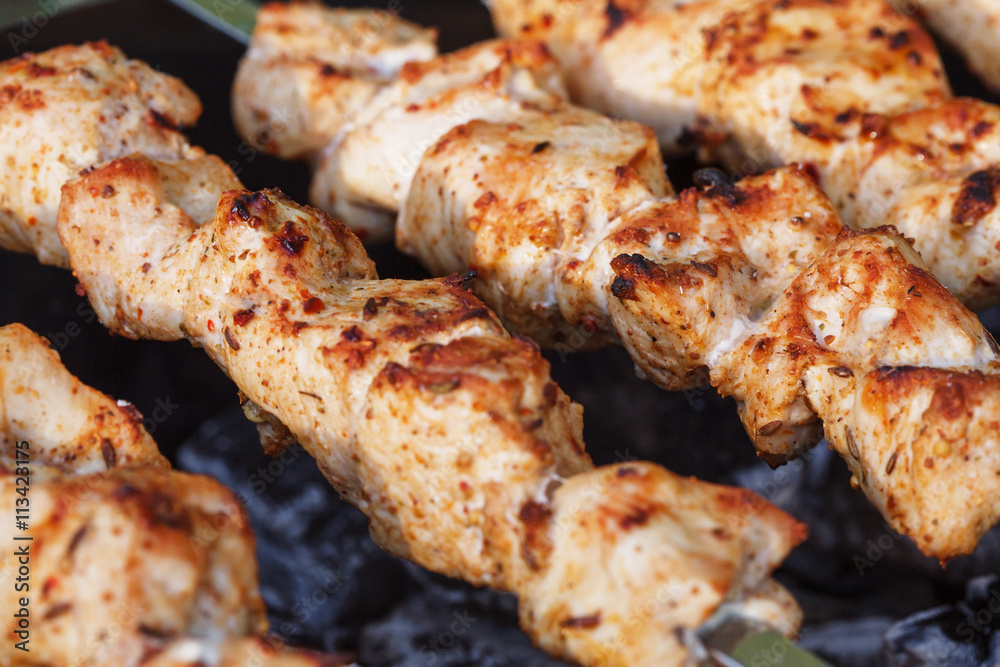 Barbecue skewers with meat on the brazier. Chicken shish kebab Barbecue skewers with meat on the brazier. Chicken shish kebab