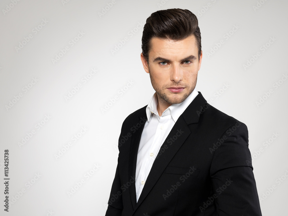 Fashion young businessman in black suit Fashion young businessman in black suit