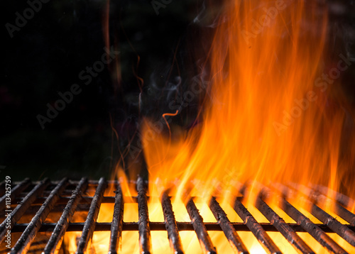Empty BBQ Flaming Charcoal Cast Iron grill.