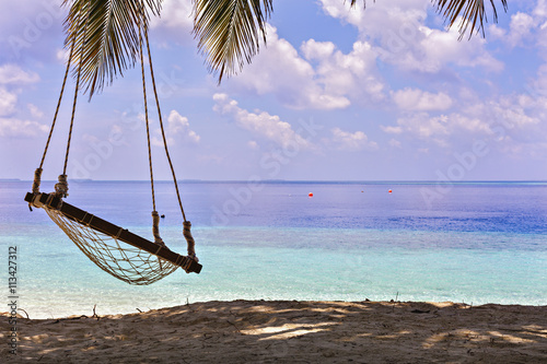 Swing with Beautiful Sun Sea Sand and Sky in Maldive, luxury tro