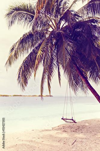 Swing with Beautiful Sun Sea Sand and Sky in Maldive, luxury tro © czamfir