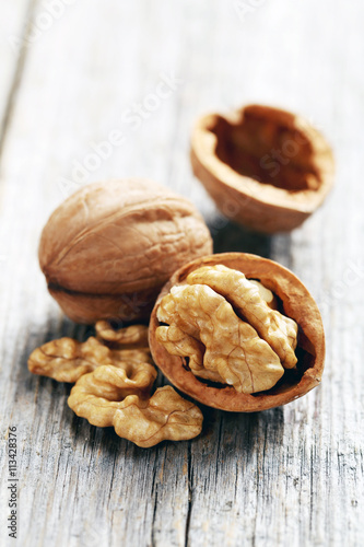 Walnuts on a grey wooden table