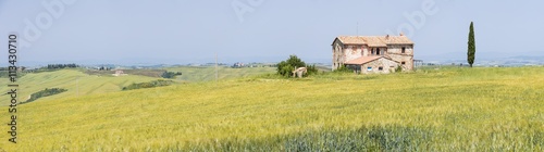 panorama with old farm in sunny day in Tuscany in Italy