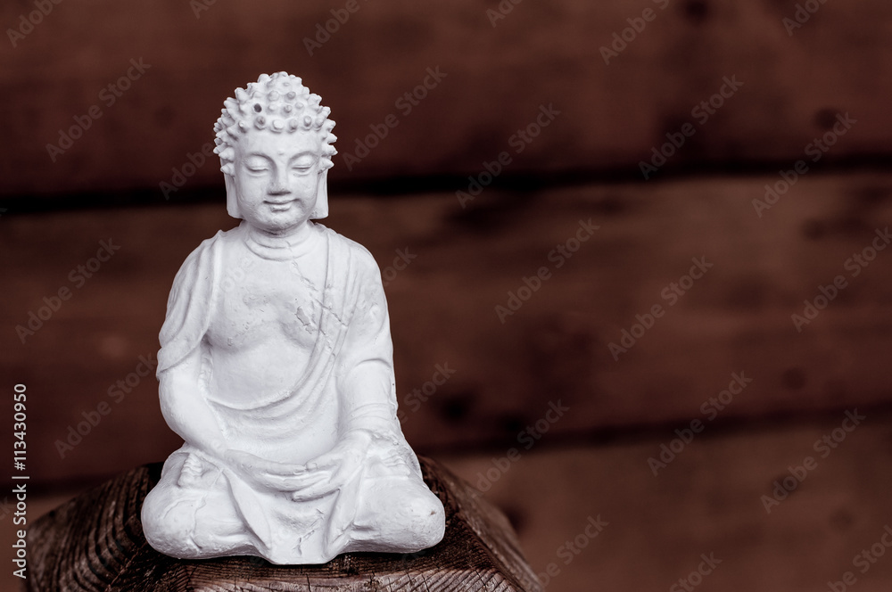 White Buddha - peaceful mind on dark background White Buddha - peaceful mind on dark background