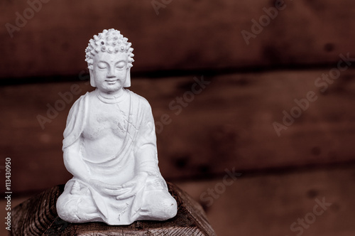 White Buddha - peaceful mind on dark background
