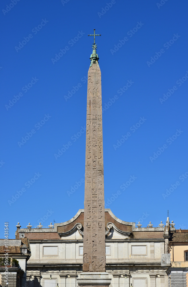 Flaminio Obelisk in the center of Piazza del Popolo square and in front roman walls. Built during the kingdom of Pharaoh Ramesses II and brought to Rome by Emperor Augustus in the 10 BC