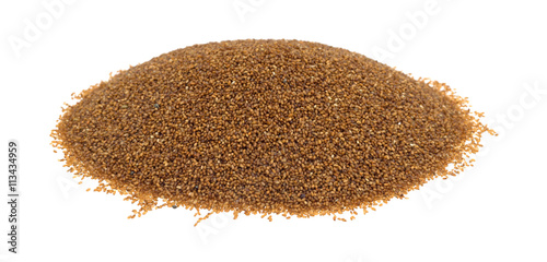 Portion of teff grain isolated on a white background side view. photo