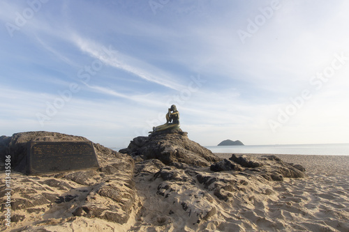 Landscape of beautiful sky and beach which has mermaid statue on rock ; Songkhla Thailand