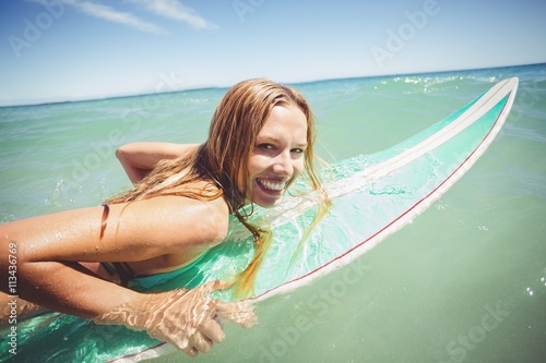 Woman surfing in sea © WavebreakMediaMicro