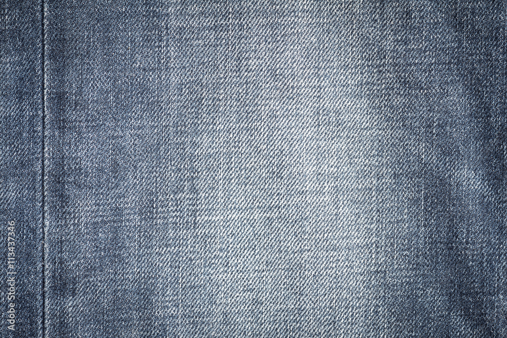 Closeup denim jeans texture. Stitched textured blue denim jeans background. Old grunge vintage denim jeans. Denim jeans fashion design. Dark edged. Closeup denim jeans texture. Stitched textured blue denim jeans background. Old grunge vintage denim jeans. Denim jeans fashion design. Dark edged.