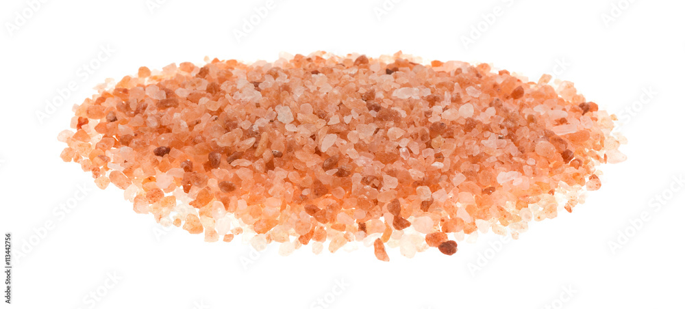 Side view of Himalayan pink salt on a white background. Side view of Himalayan pink salt on a white background.
