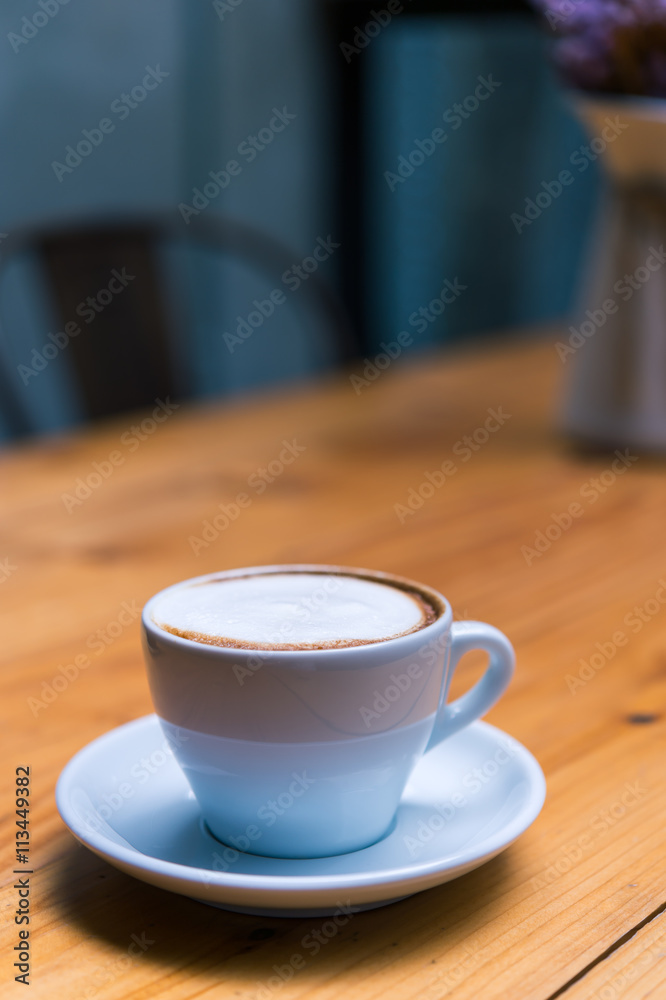 Late art coffee on wood table background