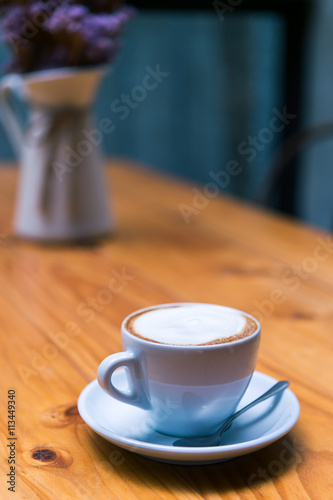 Late art coffee on wood table background