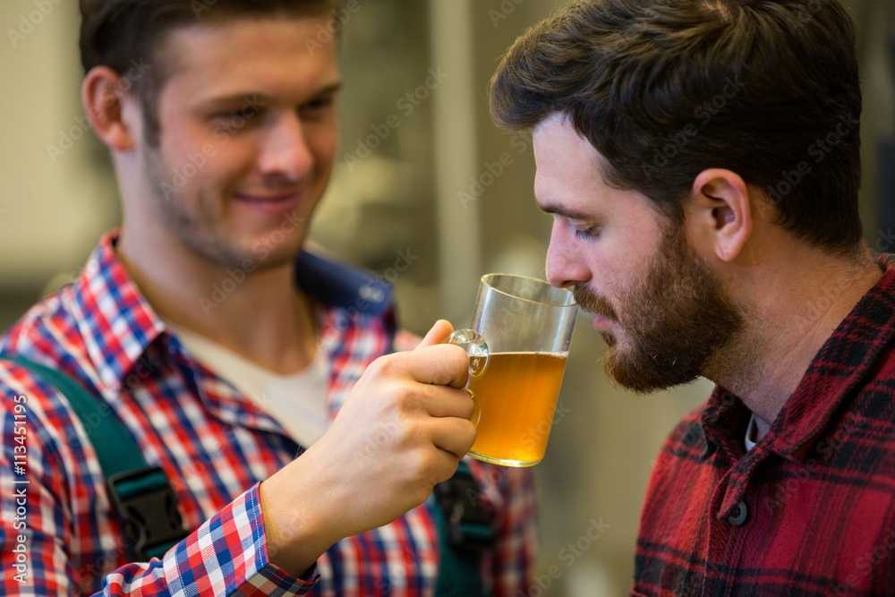 Brewers smelling beer Brewers smelling beer