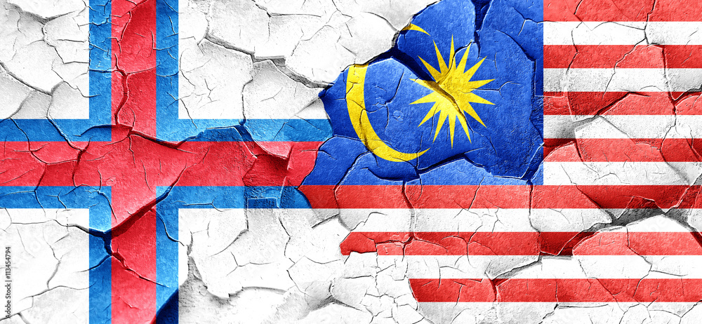 faroe islands flag with Malaysia flag on a grunge cracked wall faroe islands flag with Malaysia flag on a grunge cracked wall