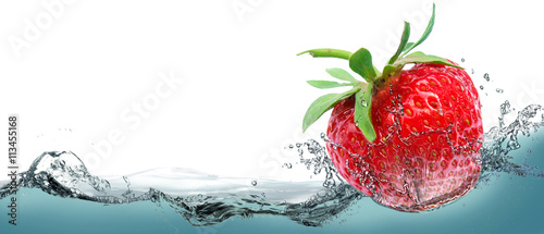 Juicy strawberry on a background of splashing water.