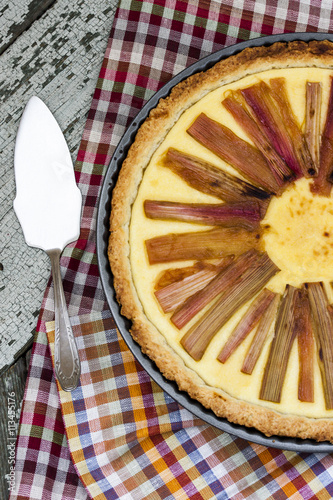 rhubarb pie on rustic background