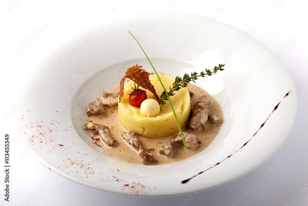 Baked meat with mashed potatoes on the white plate Baked meat with mashed potatoes on the white plate