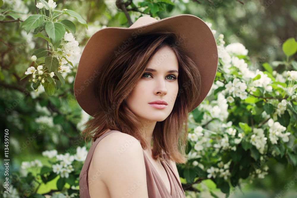 Spring Woman on Blossom Background. Sexy Glamour Summer Beautifu