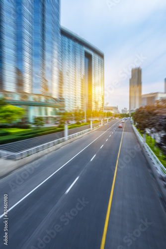 motion blurred traffic with modern buildings background