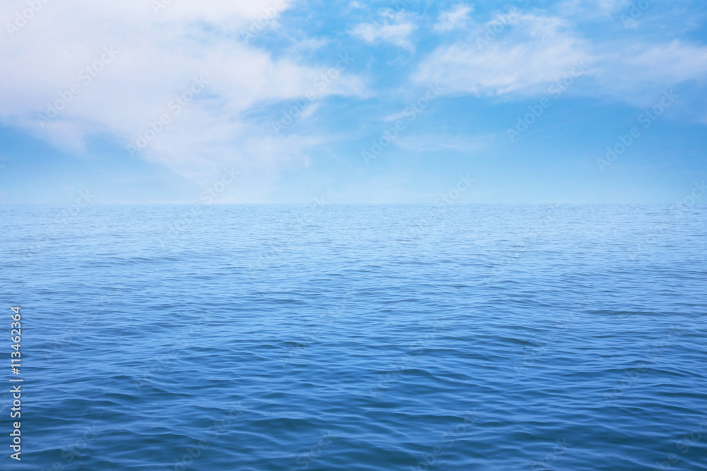 Summer seascape with blue sea and sky background

