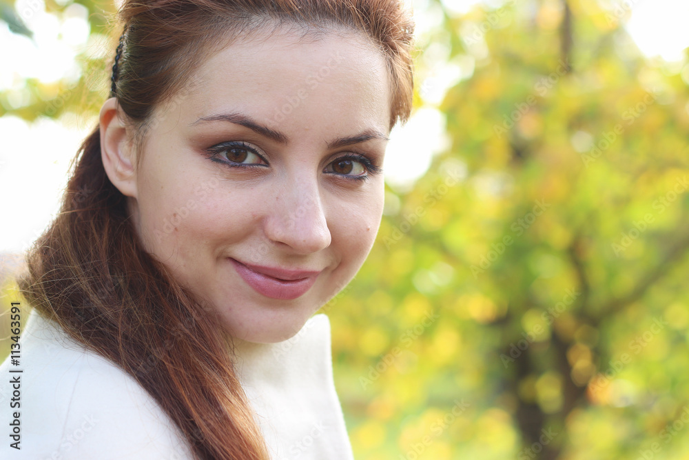 girl walking in the park in autumn