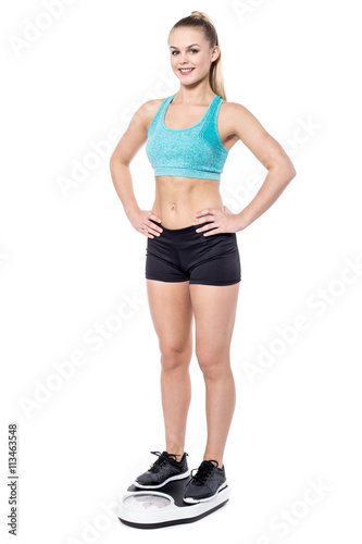 Young healthy lady with scales isolated